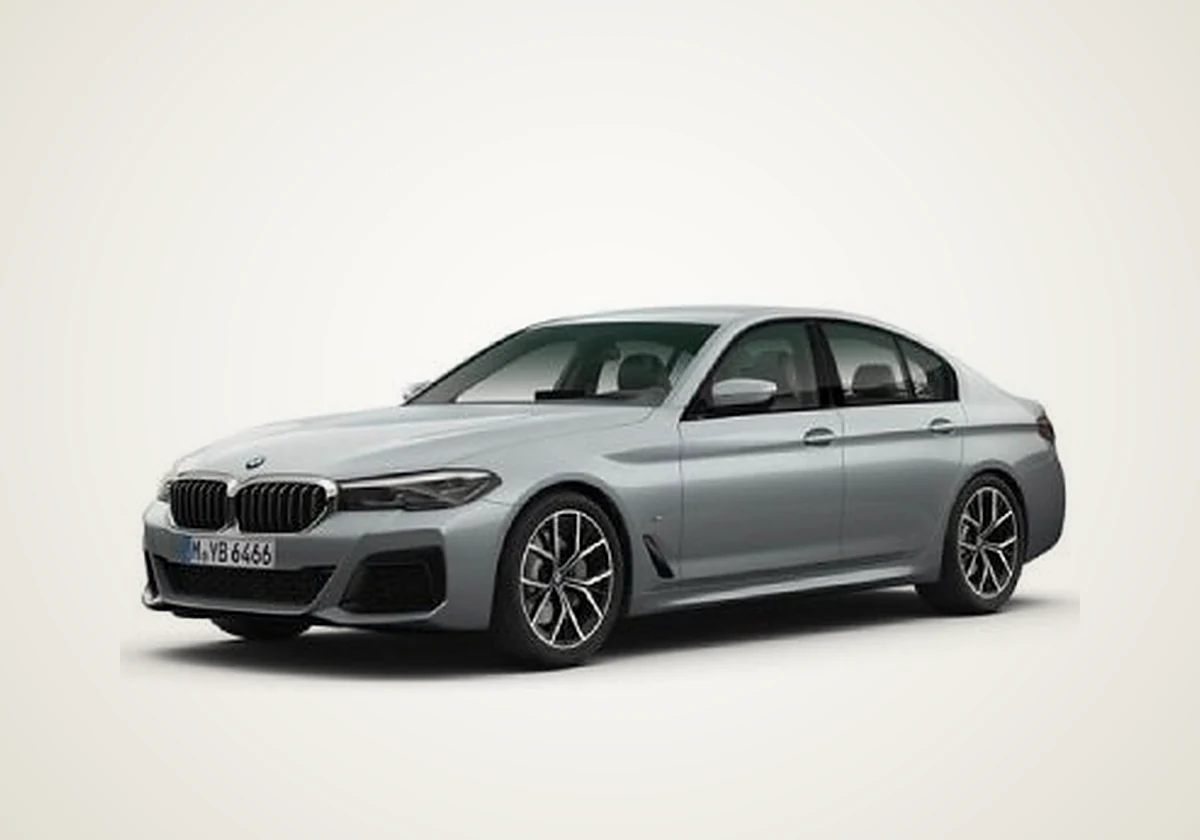 BMW 5 Series sedan in silver, front three-quarter view